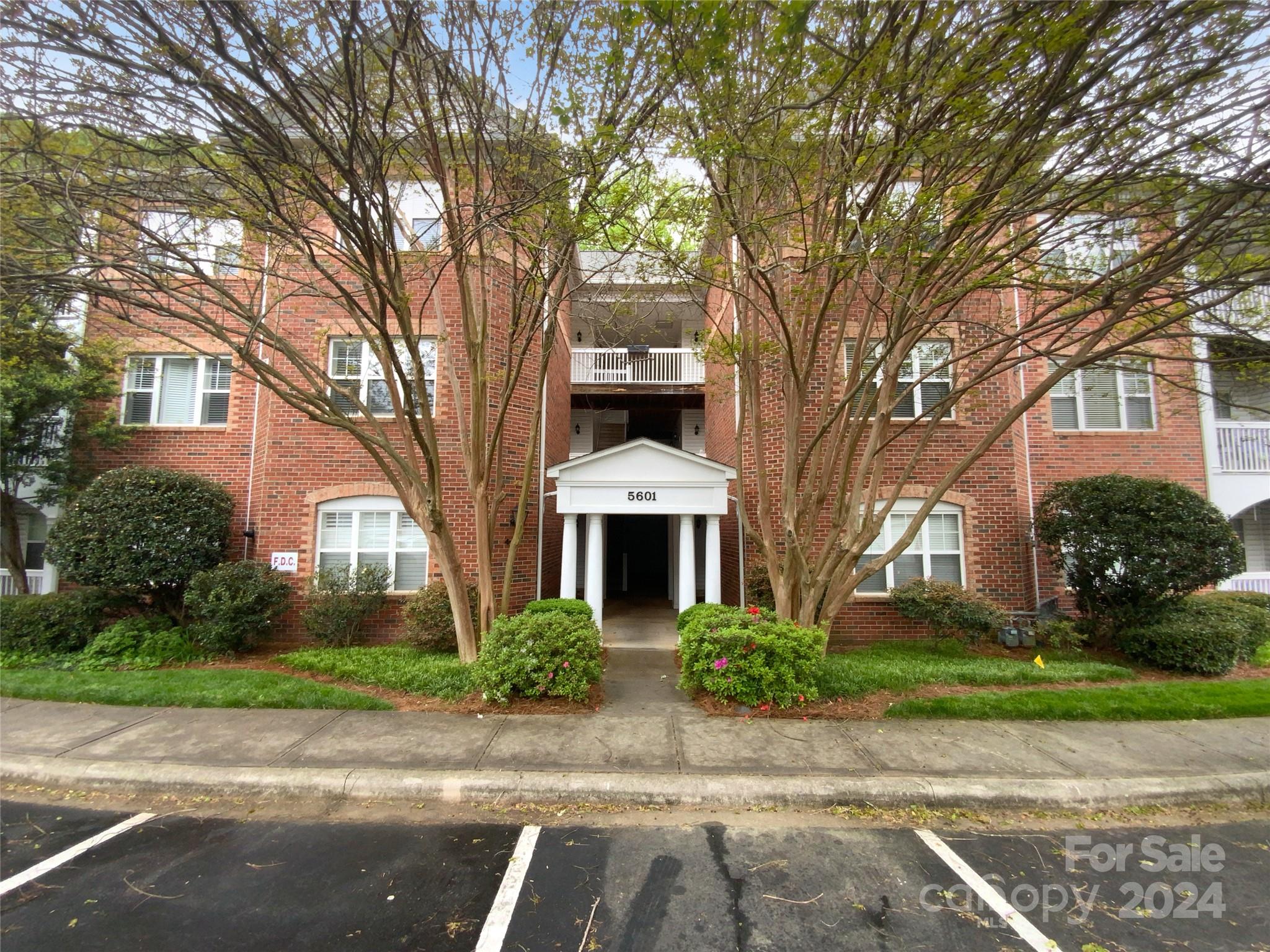 5601 Fairview Road, Unit 5 Charlotte, NC 28209 - Photo 1 of 16 front view of a house with a garden