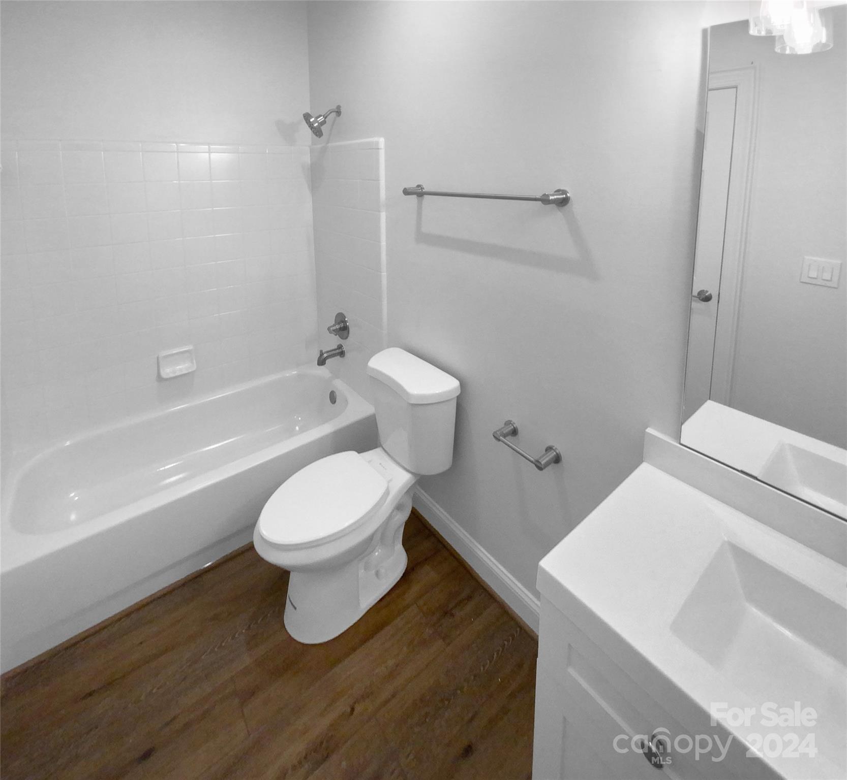 5601 Fairview Road, Unit 5 Charlotte, NC 28209 - Photo 14 of 16 a bathroom with a toilet and a bathtub