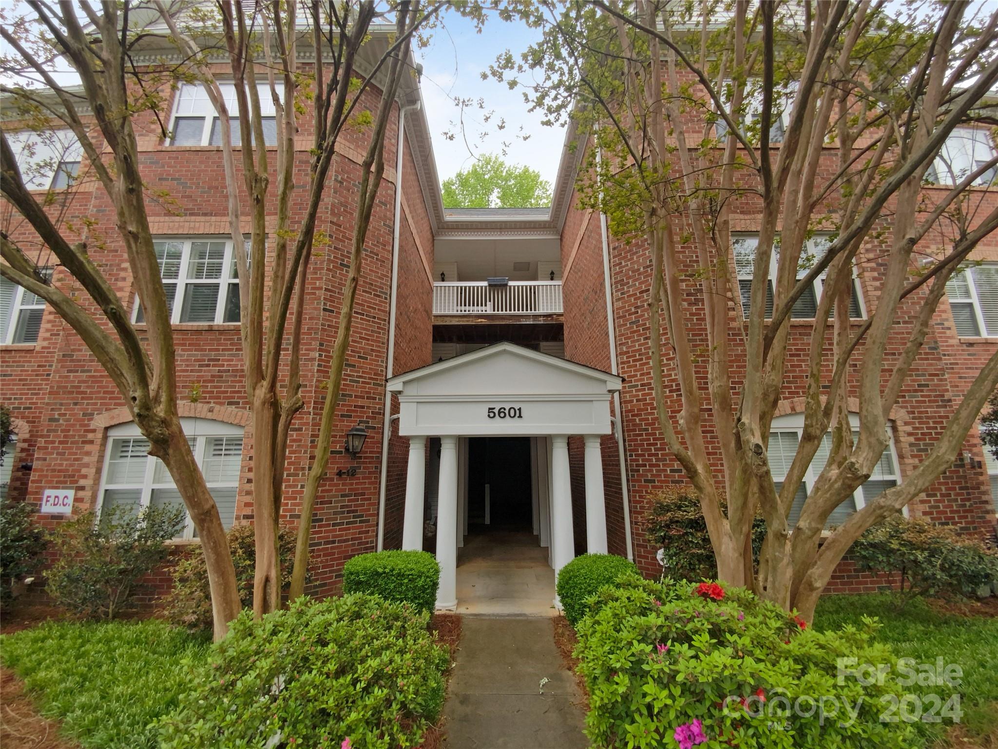 5601 Fairview Road, Unit 5 Charlotte, NC 28209 - Photo 2 of 16 front view of a house with a garden