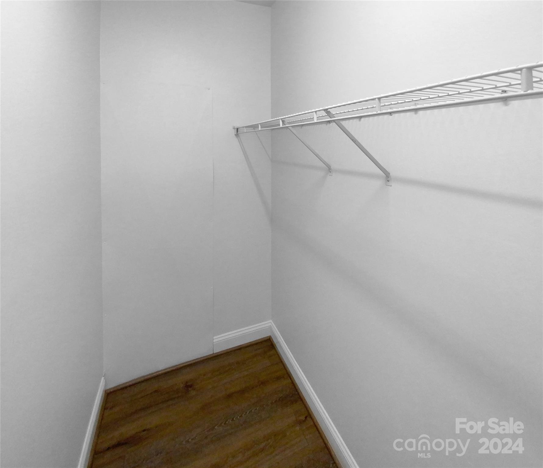 5601 Fairview Road, Unit 5 Charlotte, NC 28209 - Photo 4 of 16 a view of small space with racks on the wall