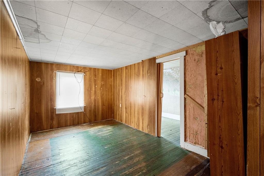 11 Madison Street Cokeburg, PA 15324 - Photo 26 of 35 a view of an empty room with wooden floor and a window