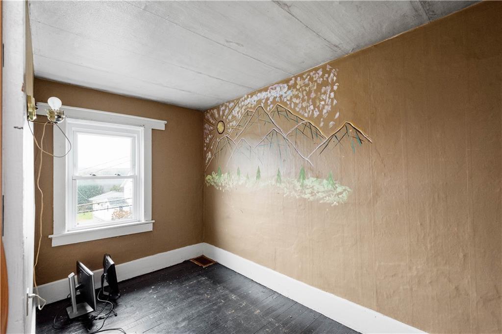 11 Madison Street Cokeburg, PA 15324 - Photo 27 of 35 a view of a big room with windows and chandelier fan