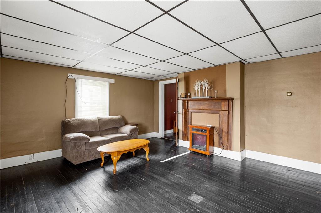 11 Madison Street Cokeburg, PA 15324 - Photo 8 of 35 a living room with furniture and a fireplace