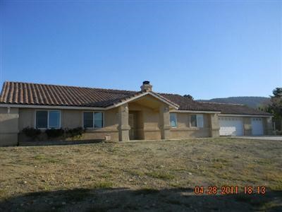545 Engman Road Pinon Hills, CA 92372 - Photo 1 of 1 a front view of a house with yard