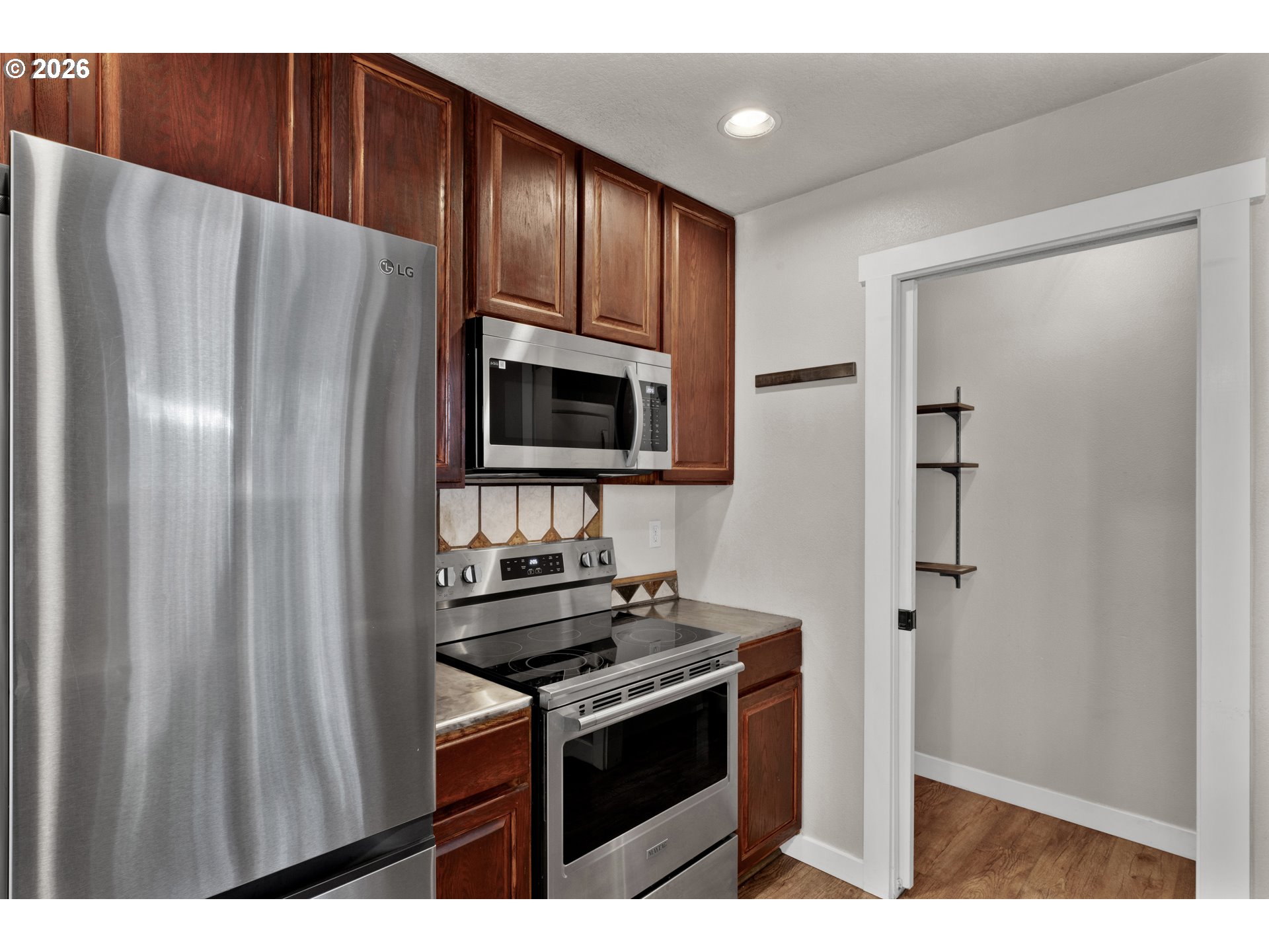 76554 Bobbe Way Oakridge, OR 97463 - Photo 11 of 47 a kitchen with stainless steel appliances a refrigerator and a stove