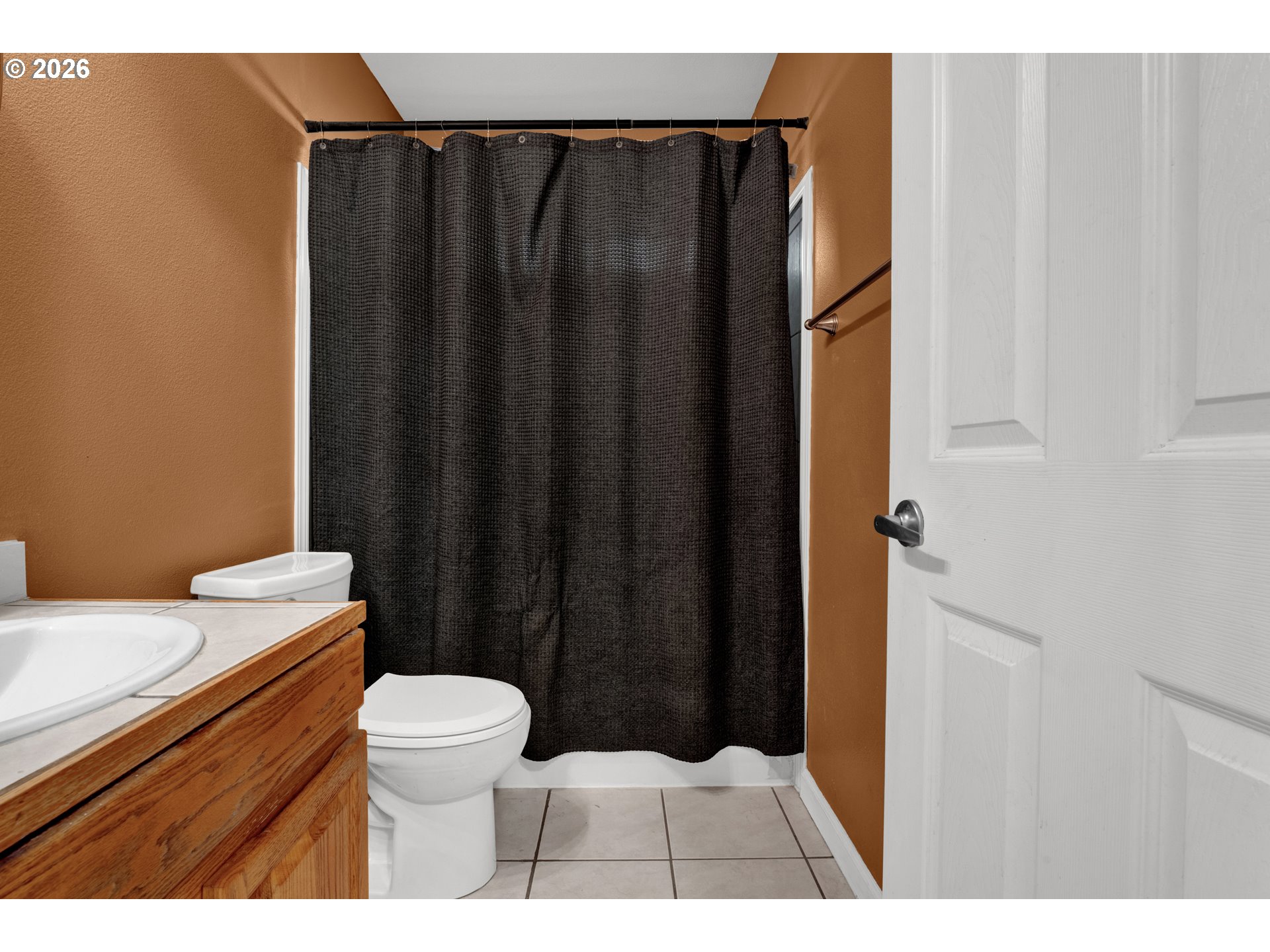 76554 Bobbe Way Oakridge, OR 97463 - Photo 20 of 47 a bathroom with a sink a toilet a shower curtain and a mirror