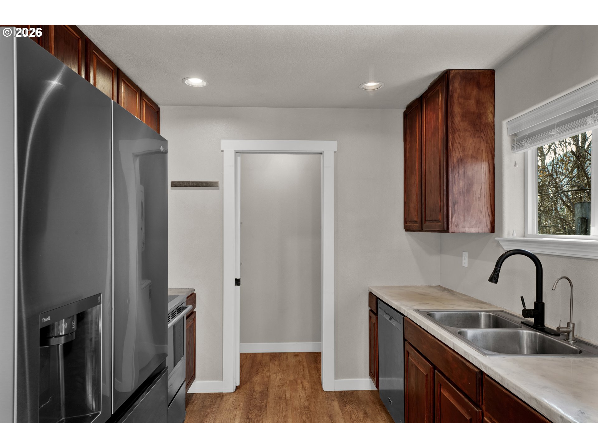 76554 Bobbe Way Oakridge, OR 97463 - Photo 9 of 47 a kitchen with a sink and a refrigerator