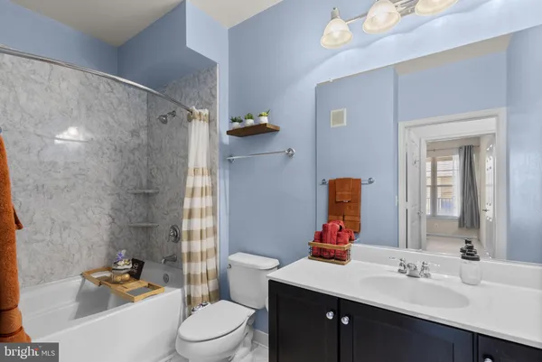 a bathroom with a bathtub and a shower