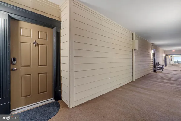 a view of a hallway with closet