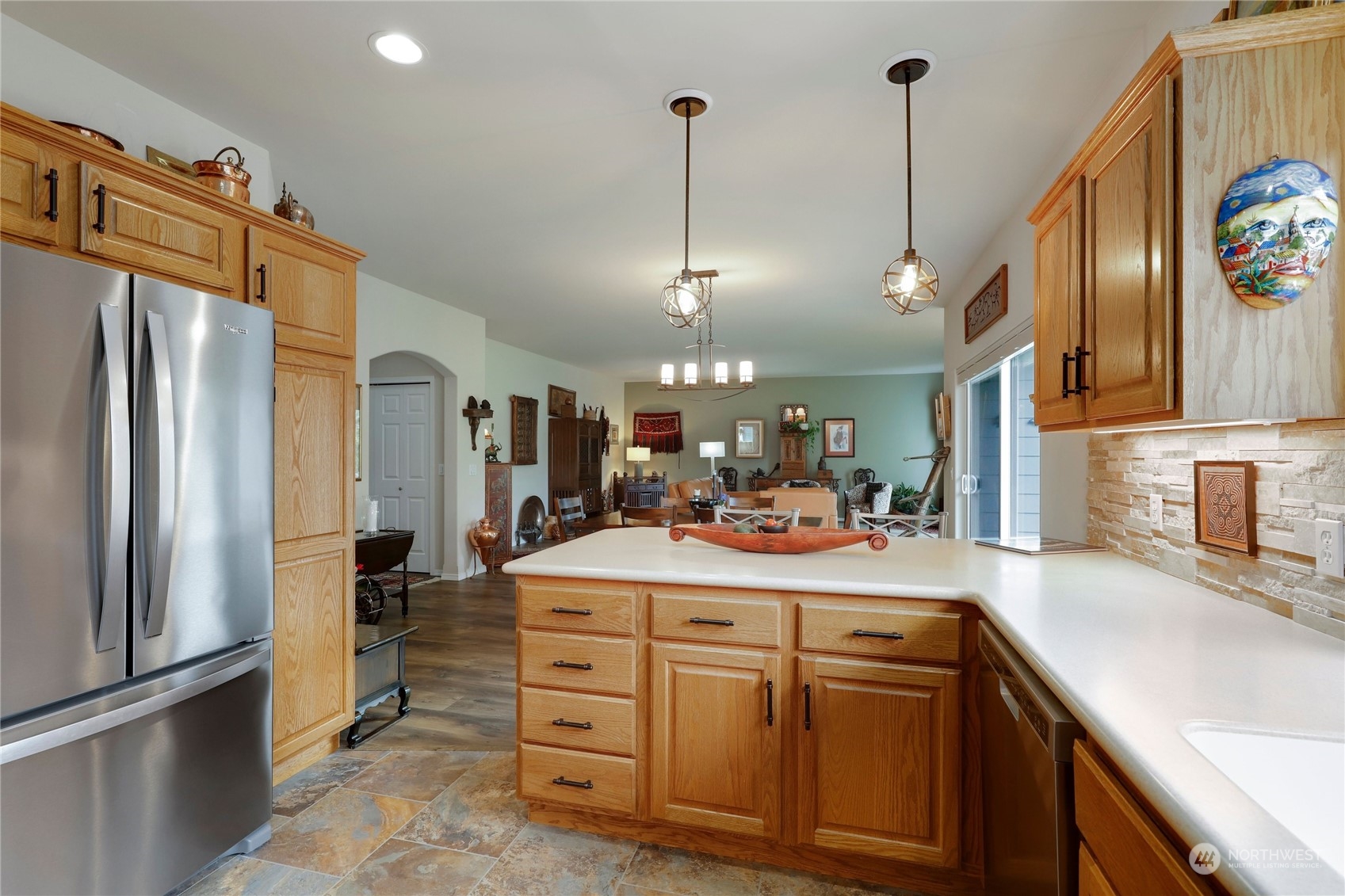 421 Blakely Boulevard Sequim, WA 98382 - Photo 14 of 35 a kitchen with sink cabinets and refrigerator