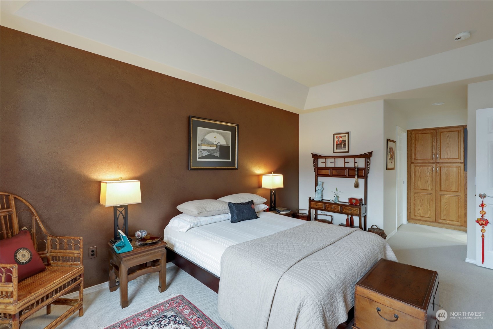 421 Blakely Boulevard Sequim, WA 98382 - Photo 18 of 35 a bedroom with a bed a dresser and book shelf