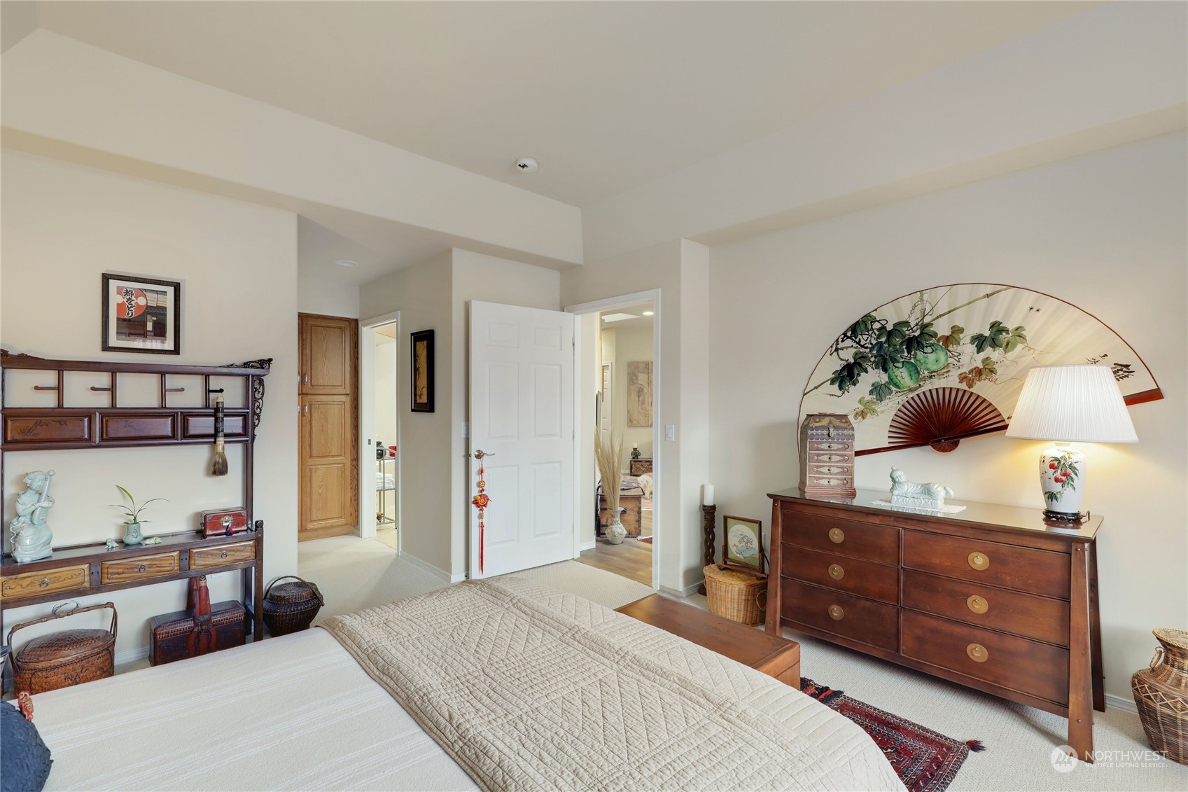 421 Blakely Boulevard Sequim, WA 98382 - Photo 19 of 35 a bedroom with a bed and a dresser