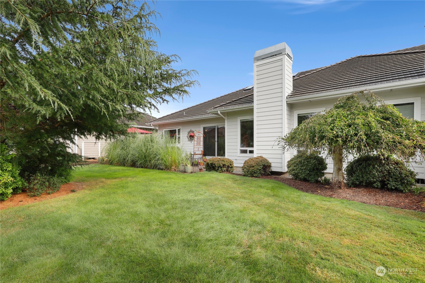 421 Blakely Boulevard Sequim, WA 98382 - Photo 2 of 35 a view of a house with a yard and basketball ground