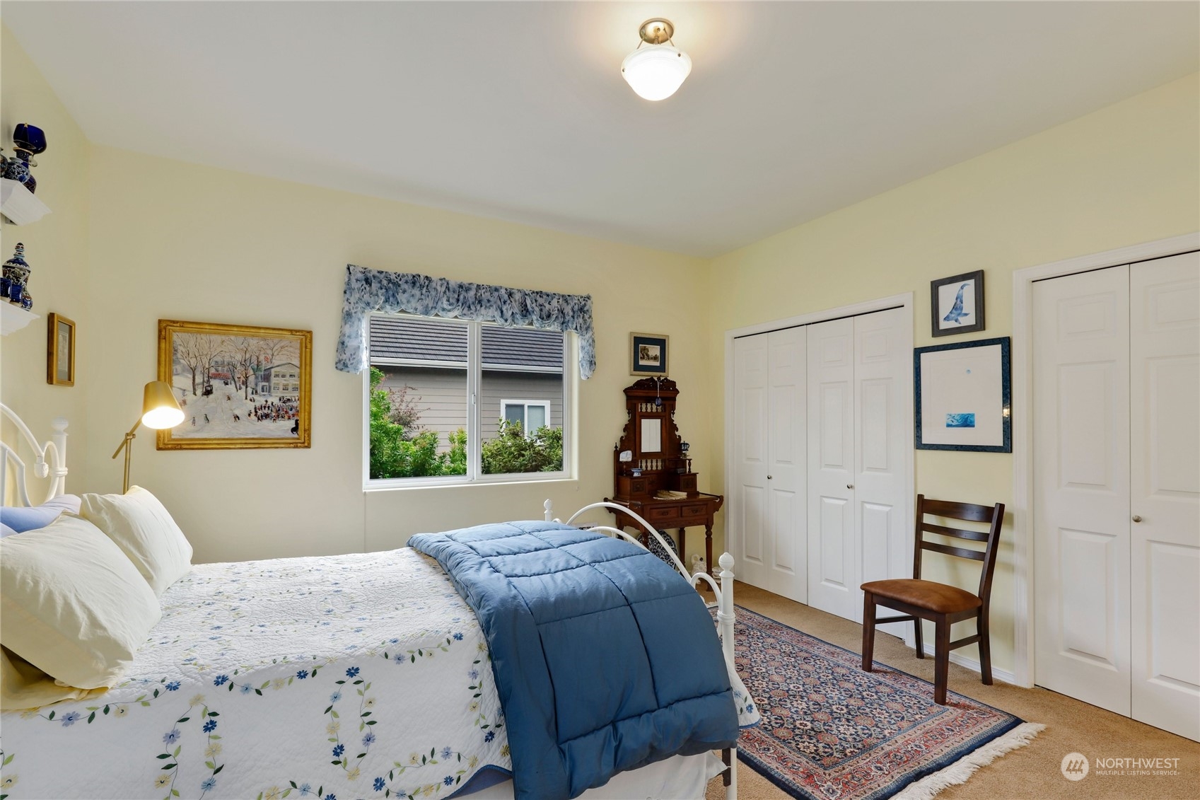 421 Blakely Boulevard Sequim, WA 98382 - Photo 25 of 35 a bedroom with a bed and a dresser in it