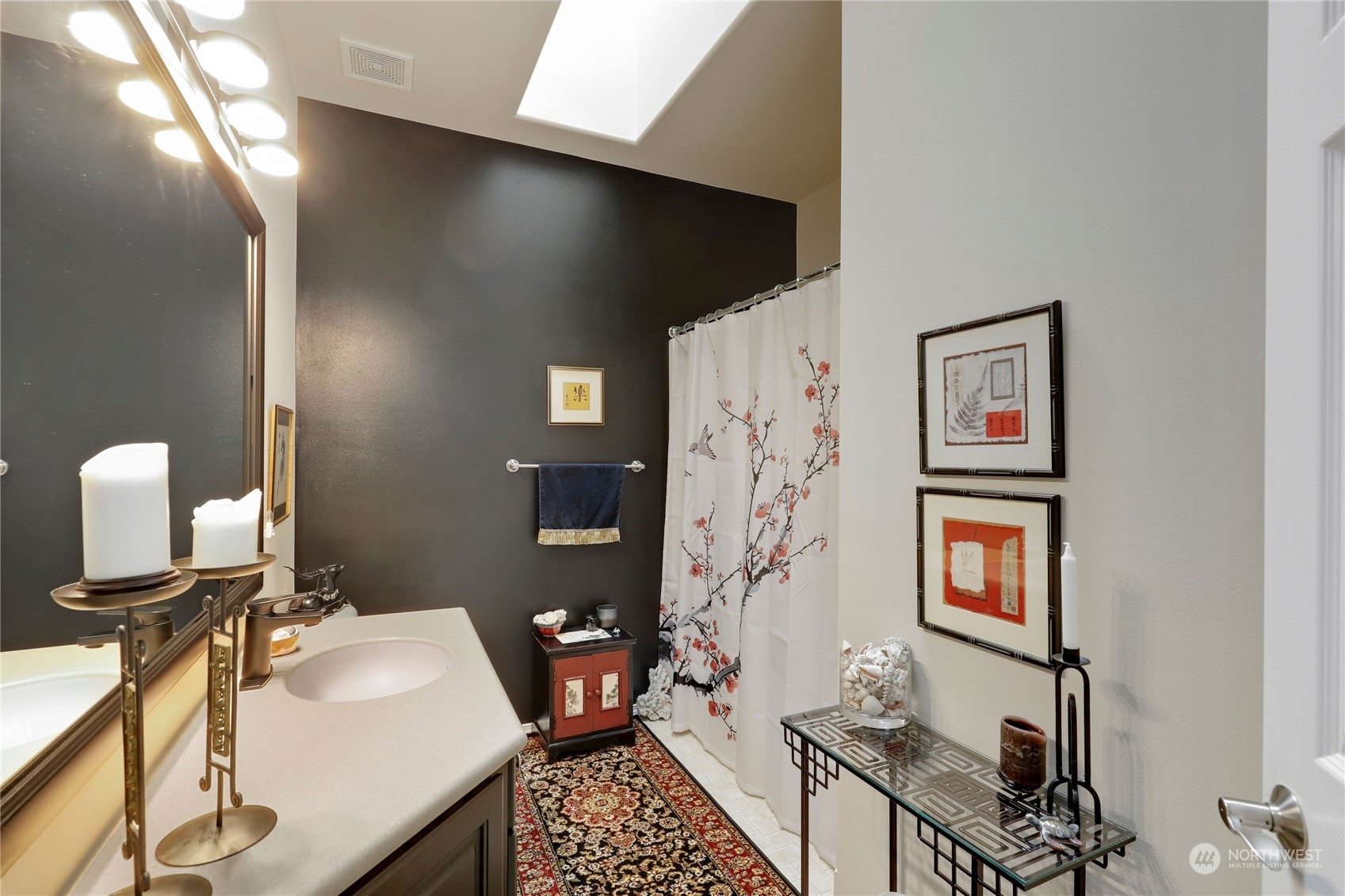 421 Blakely Boulevard Sequim, WA 98382 - Photo 26 of 35 a bathroom with a sink toilet and a mirror