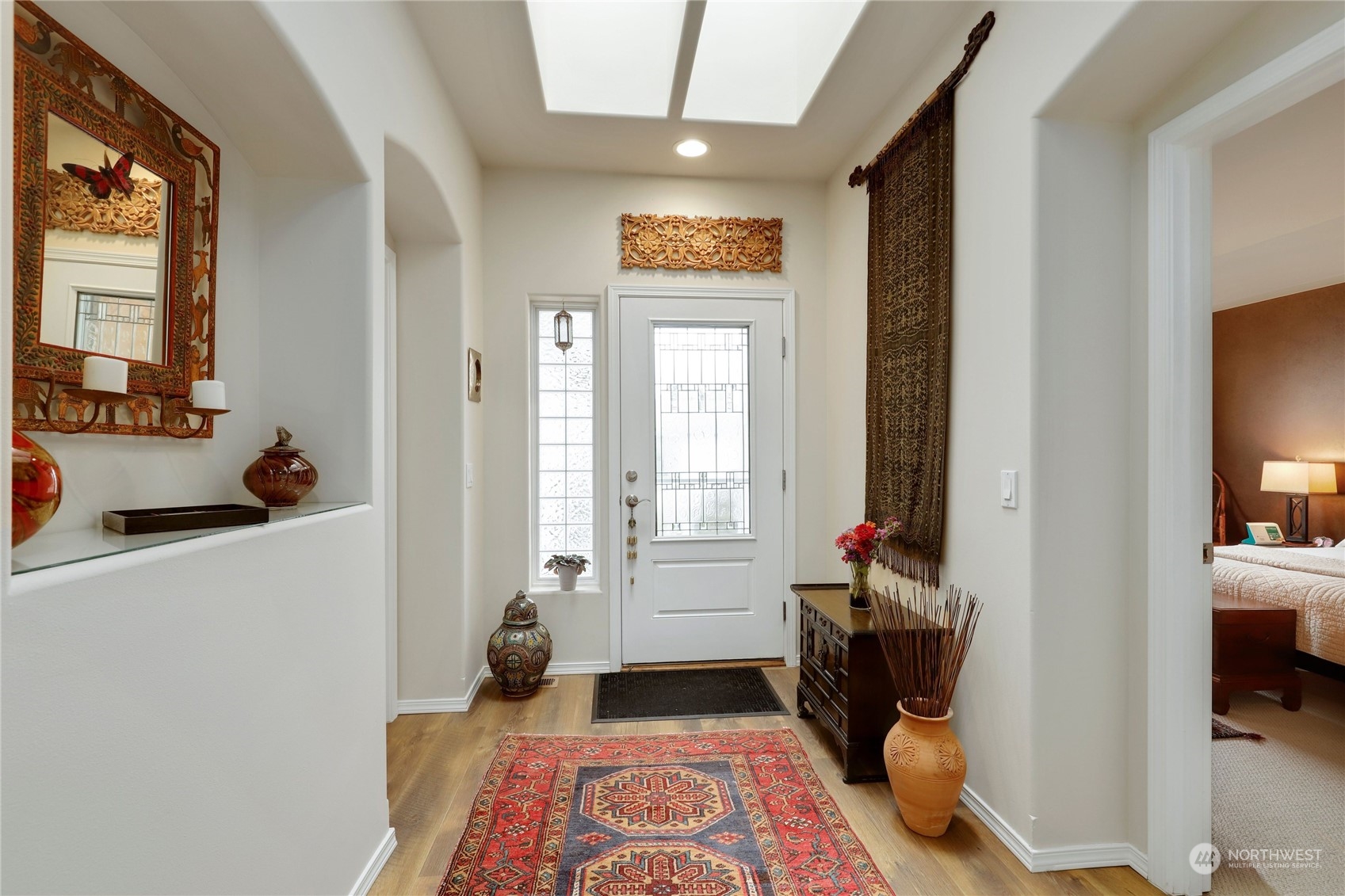 421 Blakely Boulevard Sequim, WA 98382 - Photo 30 of 35 a bedroom with a bed and a large window