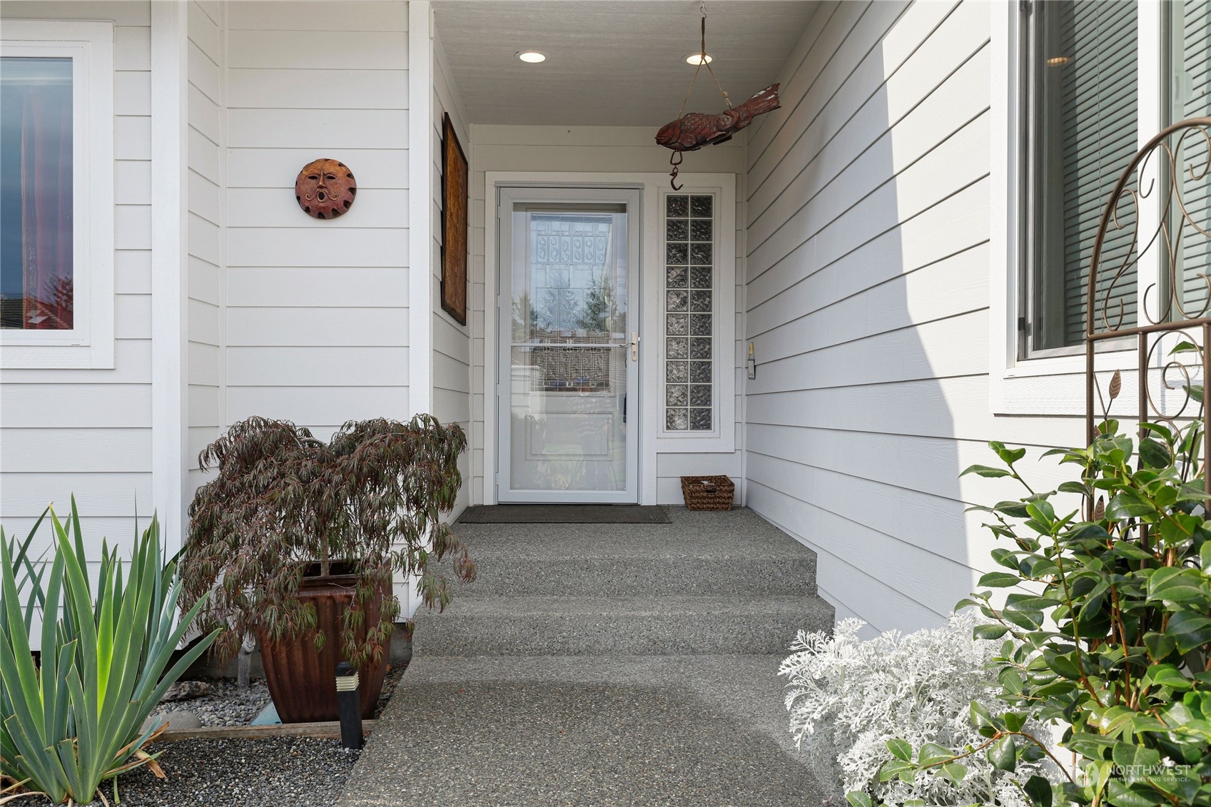 421 Blakely Boulevard Sequim, WA 98382 - Photo 3 of 35 a view of a door of the house with a potted plant