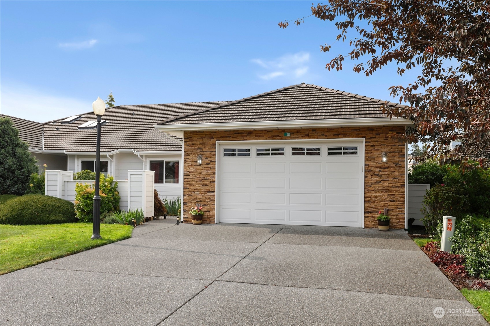 421 Blakely Boulevard Sequim, WA 98382 - Photo 33 of 35 a front view of a house with a yard and garage