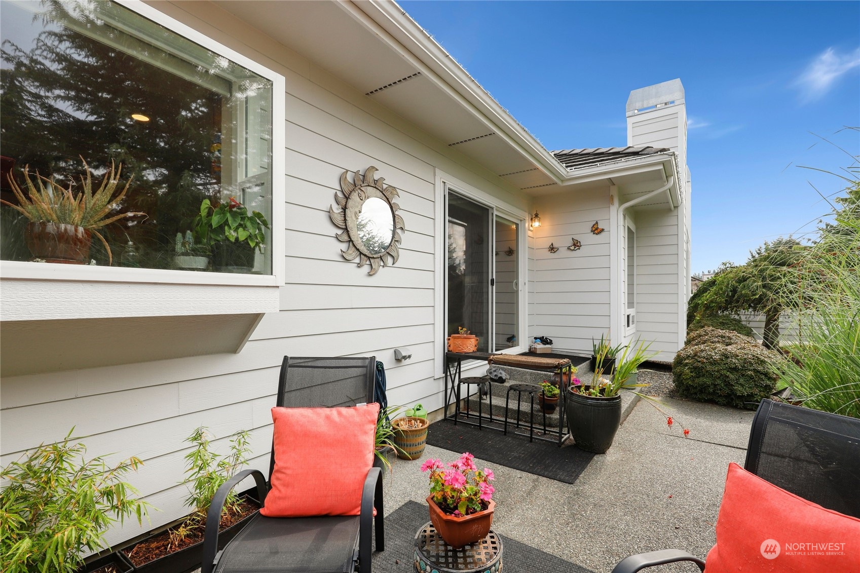 421 Blakely Boulevard Sequim, WA 98382 - Photo 9 of 35 a building outdoor space with patio furniture and potted plants