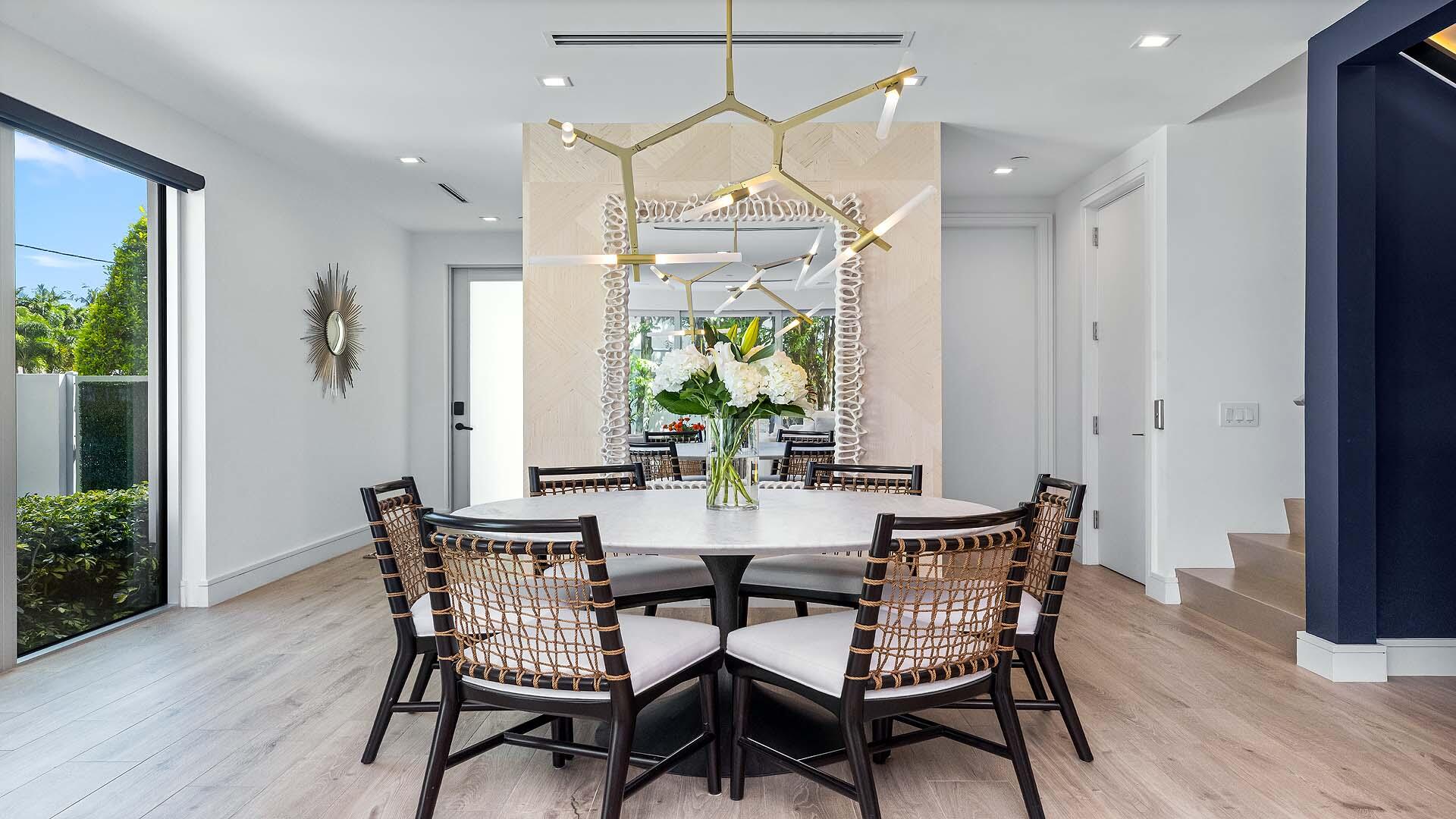 917 Bucida Road, Unit A Delray Beach, FL 33483 - Photo 11 of 36 a view of a dining room with furniture window and wooden floor
