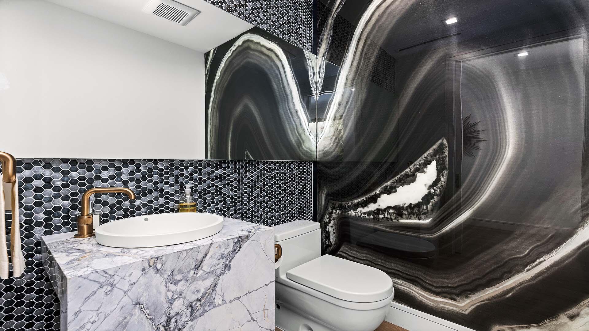 917 Bucida Road, Unit A Delray Beach, FL 33483 - Photo 12 of 36 a bathroom with a toilet sink and mirror