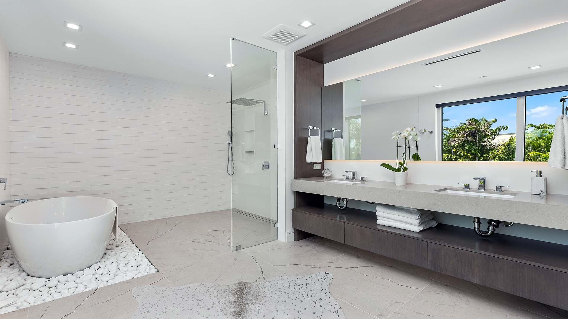 917 Bucida Road, Unit A Delray Beach, FL 33483 - Photo 17 of 36 a bathroom with a toilet sink and mirror