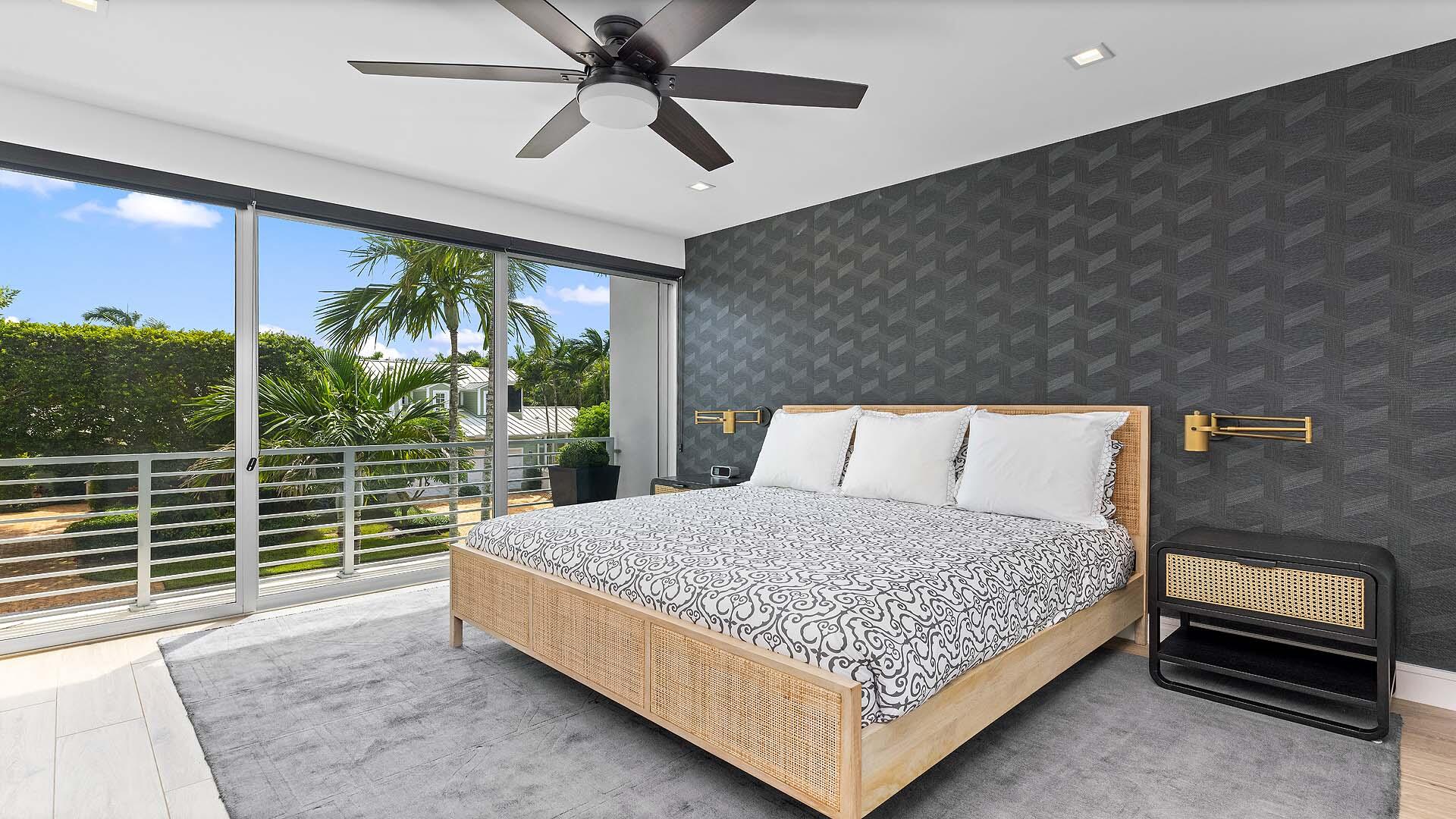 917 Bucida Road, Unit A Delray Beach, FL 33483 - Photo 20 of 36 a bed sitting in a room next to a window