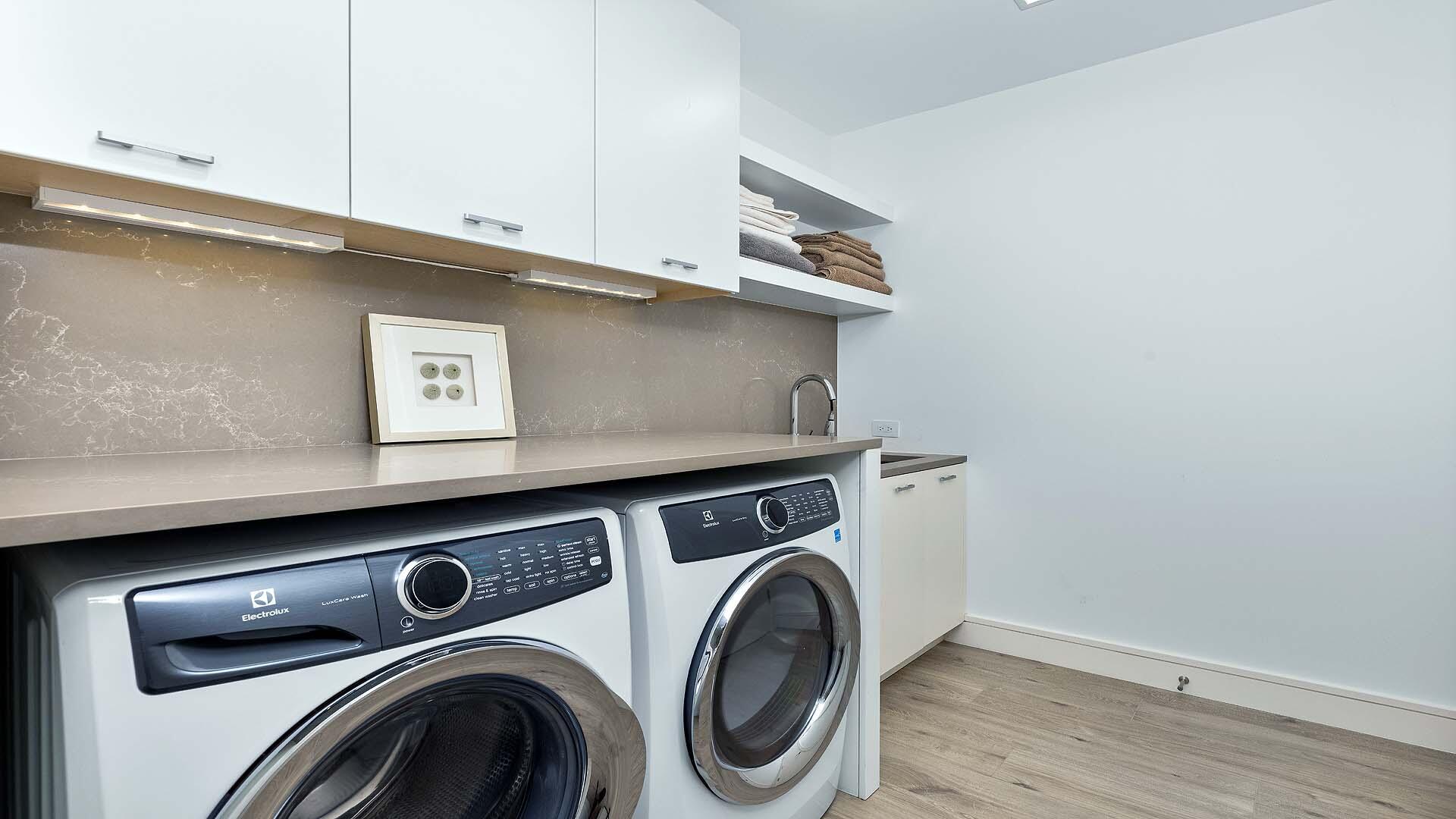 917 Bucida Road, Unit A Delray Beach, FL 33483 - Photo 22 of 36 a utility room with dryer and washer