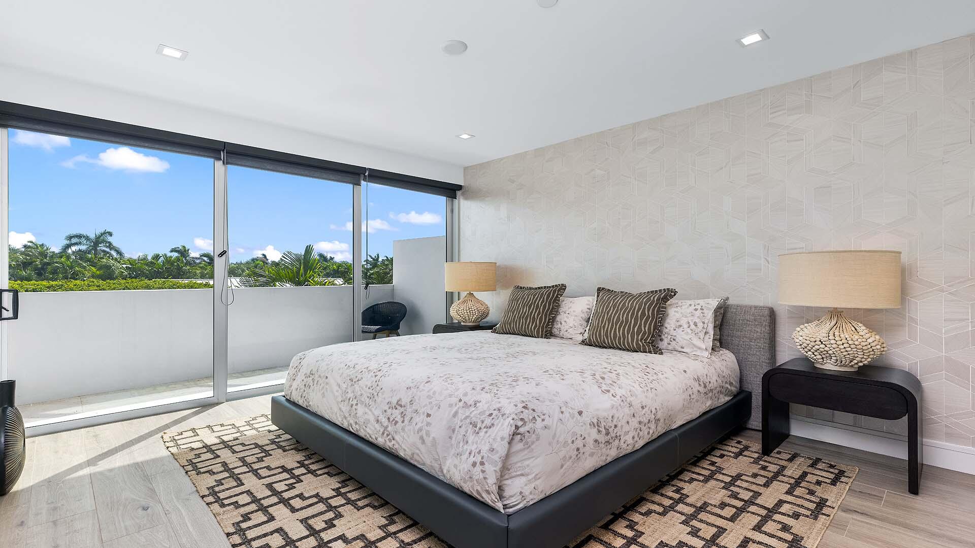 917 Bucida Road, Unit A Delray Beach, FL 33483 - Photo 24 of 36 a bedroom with a bed and a window