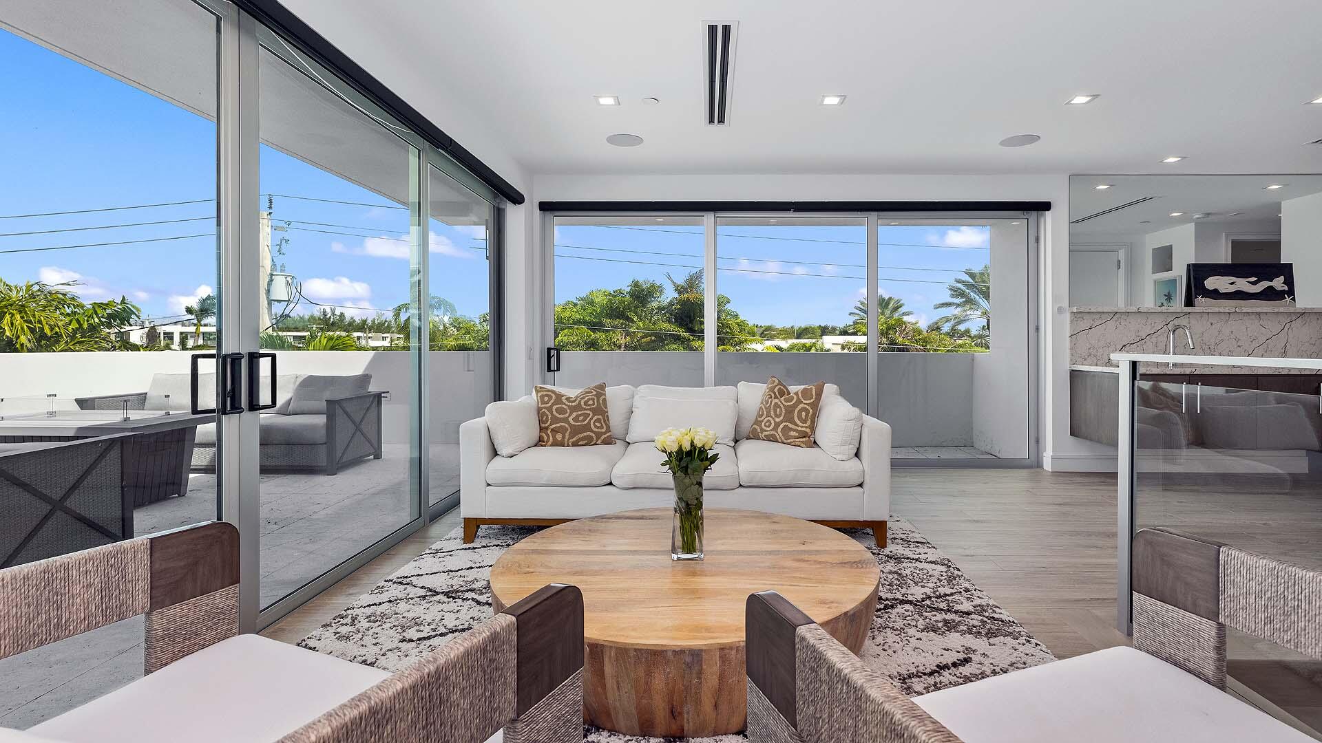 917 Bucida Road, Unit A Delray Beach, FL 33483 - Photo 29 of 36 a living room with fireplace furniture and a large window