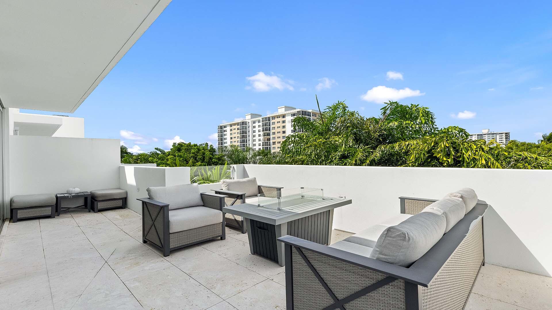 917 Bucida Road, Unit A Delray Beach, FL 33483 - Photo 30 of 36 a outdoor living space with furniture and city view