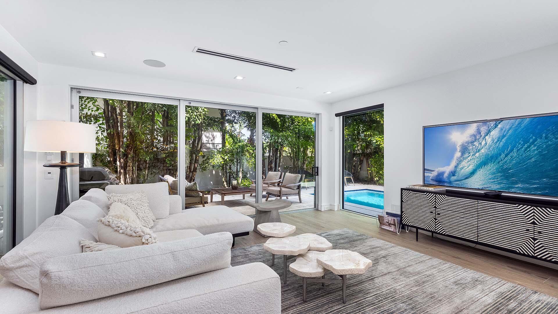 917 Bucida Road, Unit A Delray Beach, FL 33483 - Photo 4 of 36 a living room with furniture and a large window