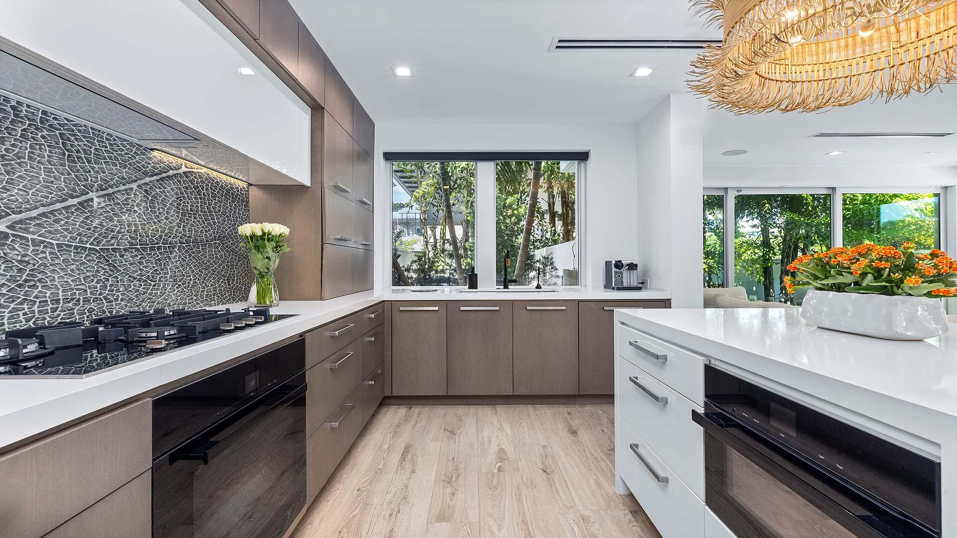 917 Bucida Road, Unit A Delray Beach, FL 33483 - Photo 7 of 36 a kitchen with a sink and stove