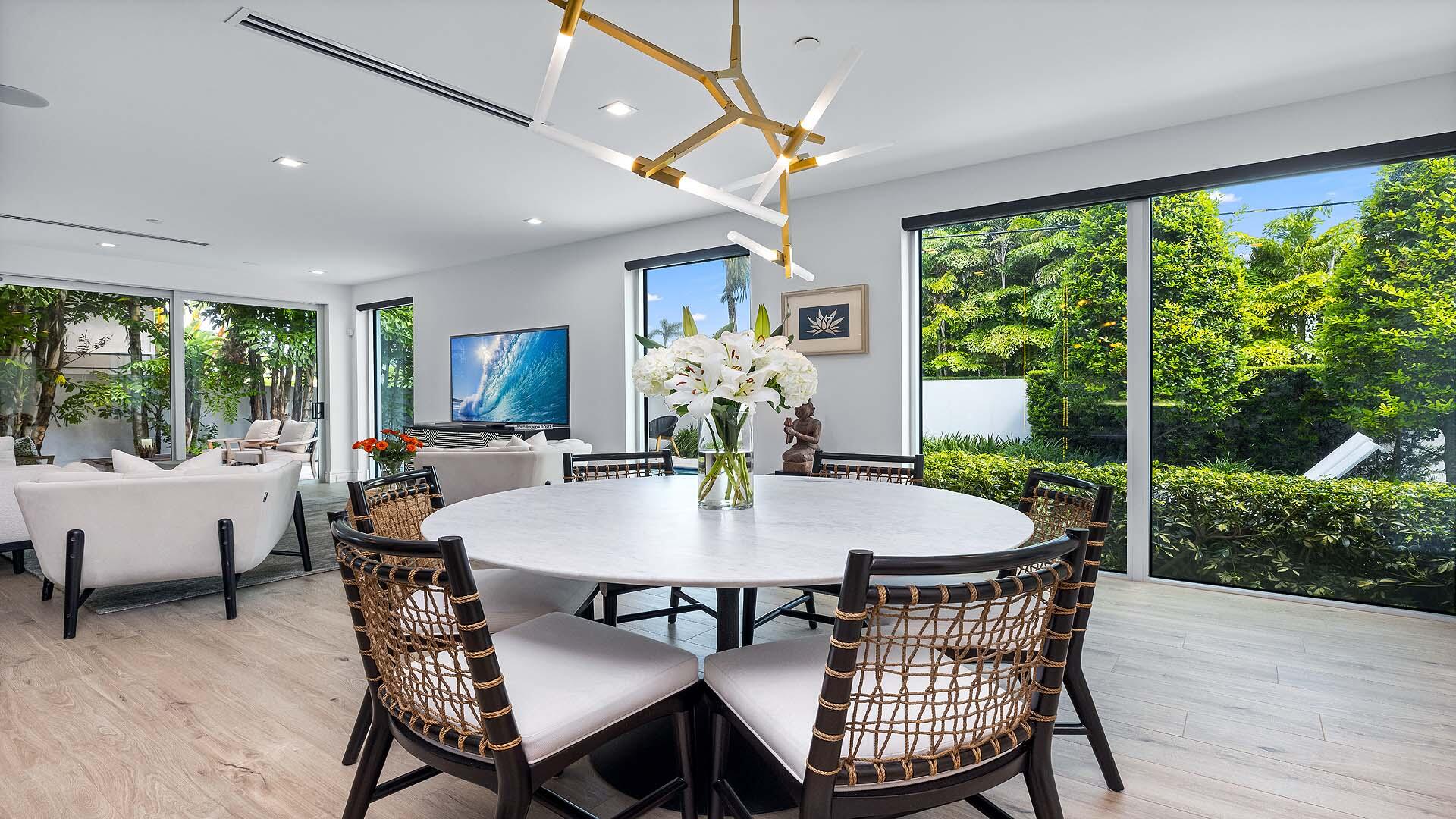 917 Bucida Road, Unit A Delray Beach, FL 33483 - Photo 10 of 36 a view of a dining room with furniture window and wooden floor