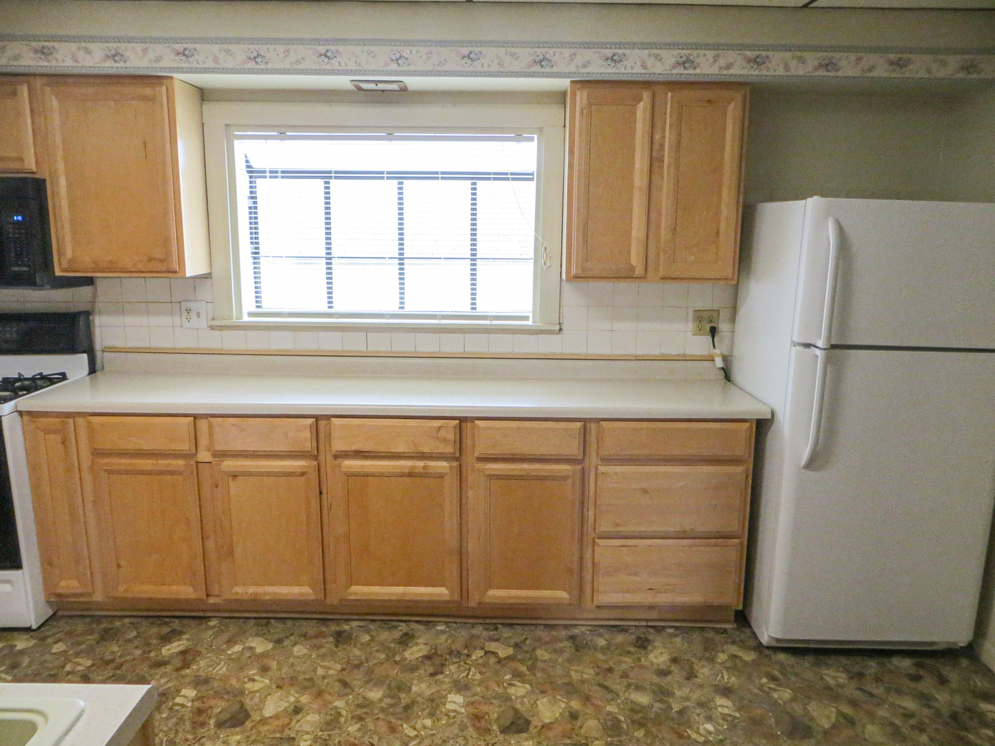 26403 West Ingleside Shore Road Ingleside, IL 60041 - Photo 3 of 10 a white refrigerator freezer sitting in a kitchen