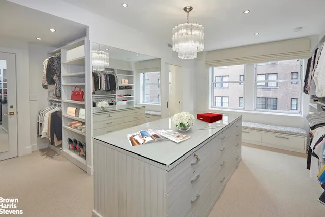 a bedroom with a large bed and a flat screen tv