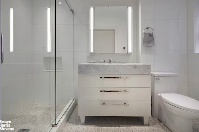 a kitchen with stainless steel appliances granite countertop a sink and a stove
