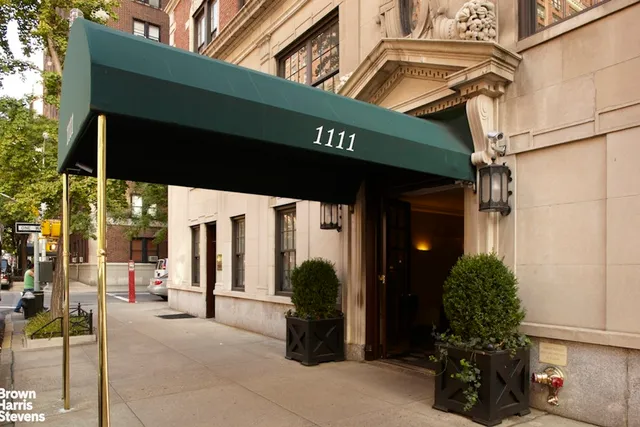 a city street filled with lots of tall buildings