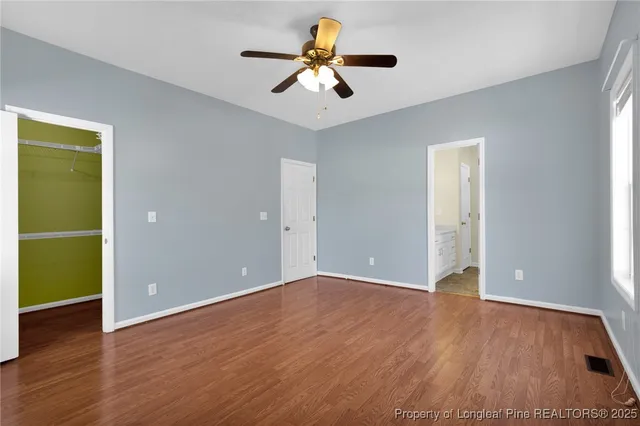 a bathroom with a bathtub and a window