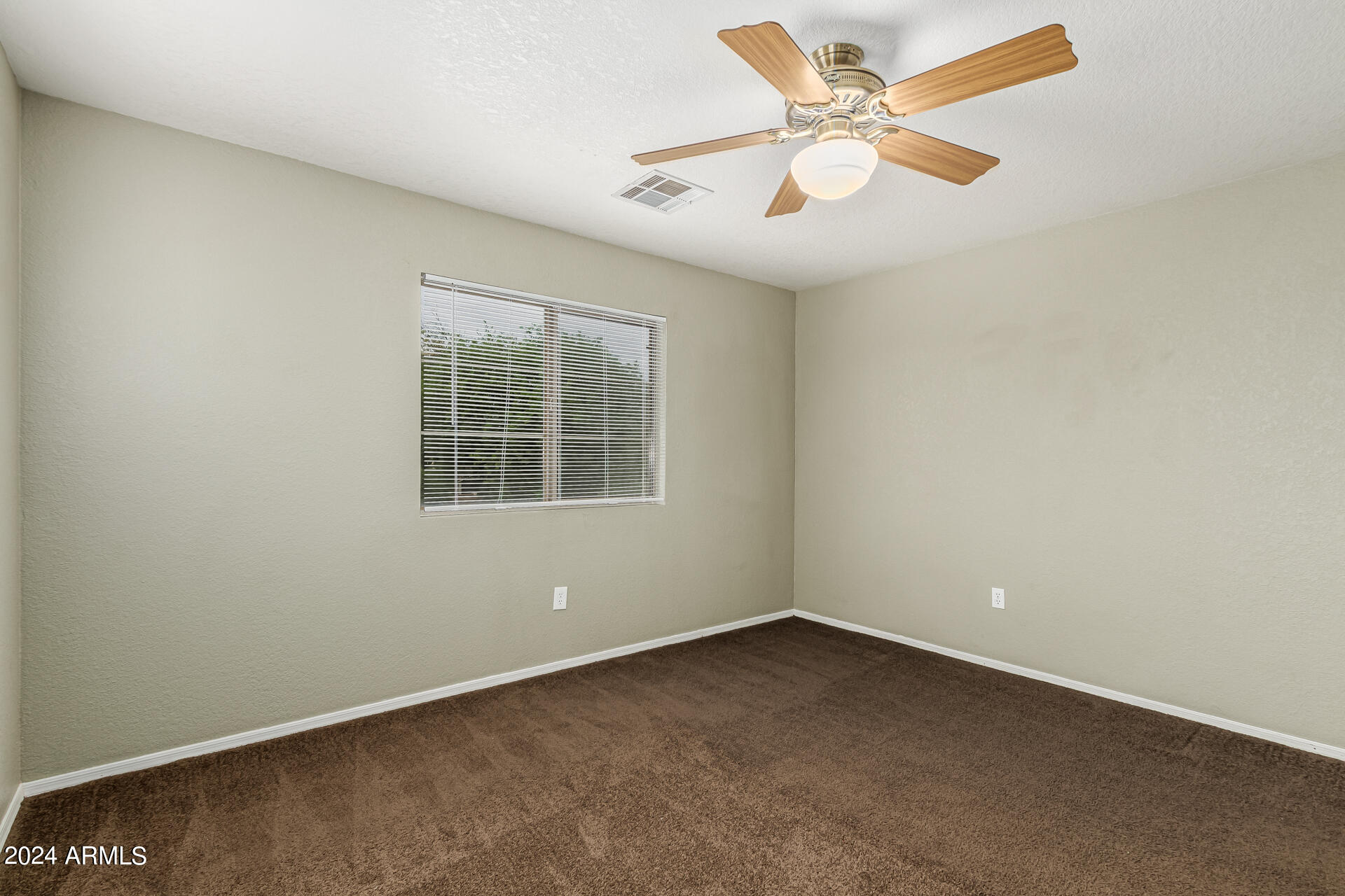 1371 South Boulder Street, Unit A Gilbert, AZ 85296 - Photo 20 of 43 an empty room with a window and a fan