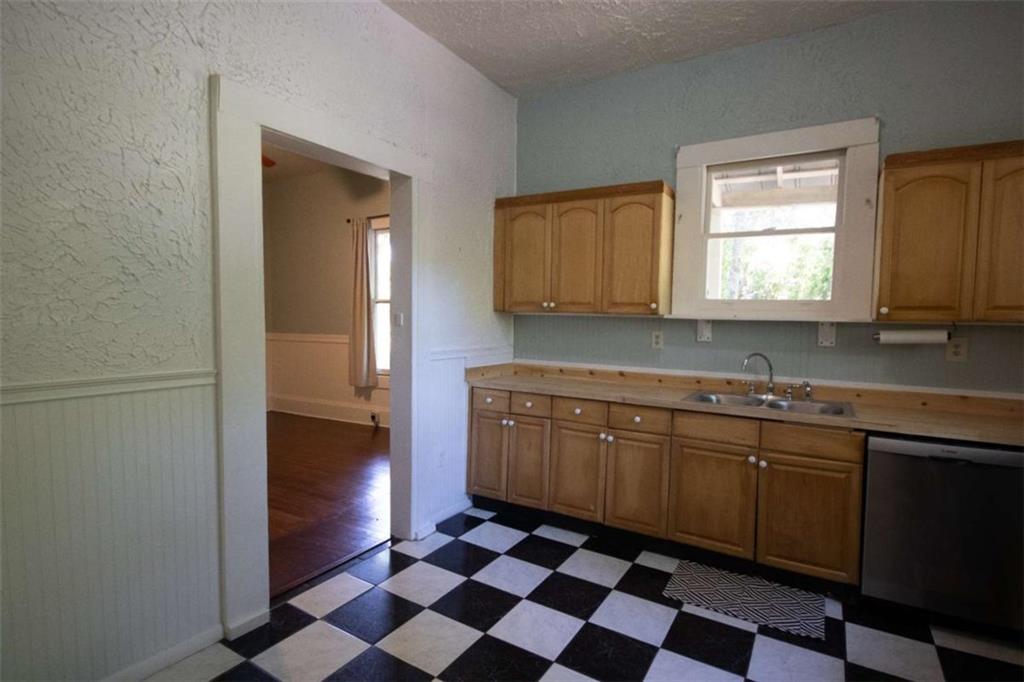 285 East Main Street Forsyth, GA 31029 - Photo 11 of 27 a kitchen with stainless steel appliances granite countertop a sink and a microwave