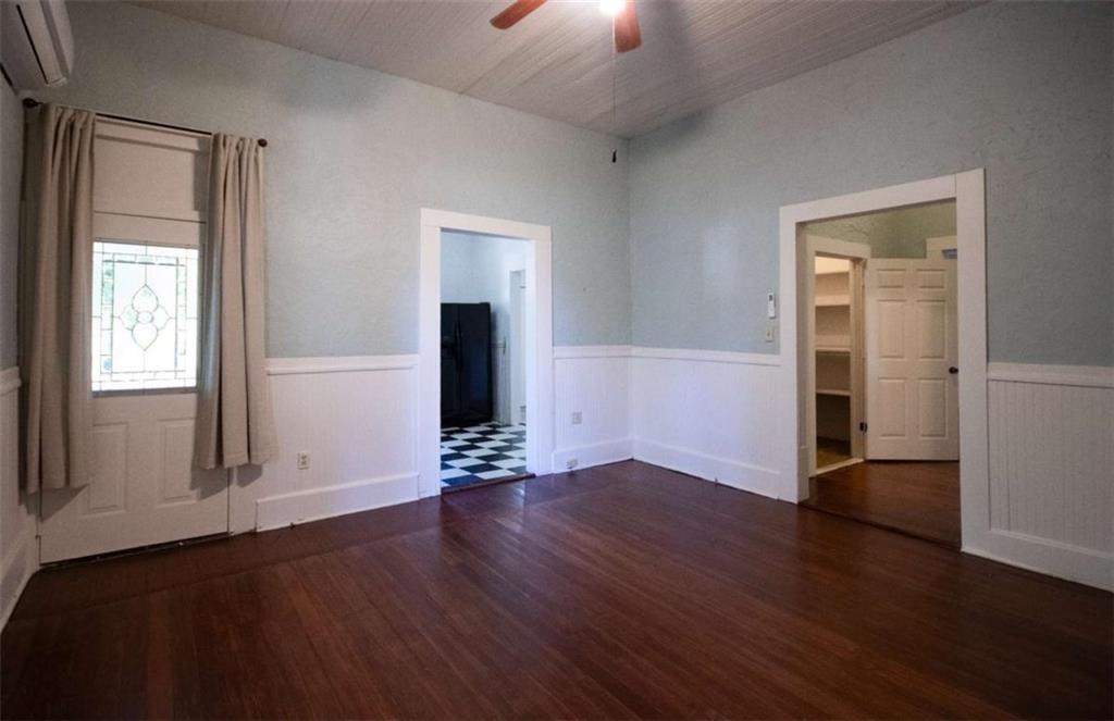 285 East Main Street Forsyth, GA 31029 - Photo 14 of 27 an empty room with wooden floor and windows