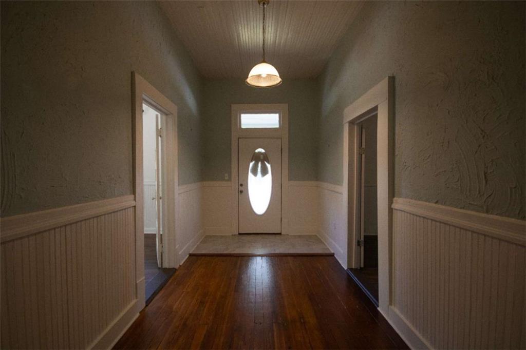 285 East Main Street Forsyth, GA 31029 - Photo 16 of 27 a view of empty room with wooden floor and window