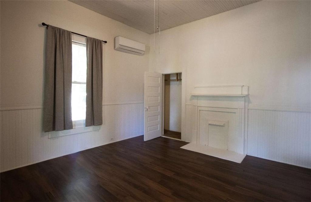285 East Main Street Forsyth, GA 31029 - Photo 17 of 27 an empty room with wooden floor closet and windows