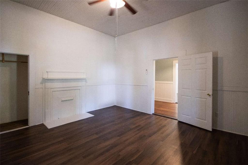 285 East Main Street Forsyth, GA 31029 - Photo 18 of 27 an empty room with wooden floor closet and windows
