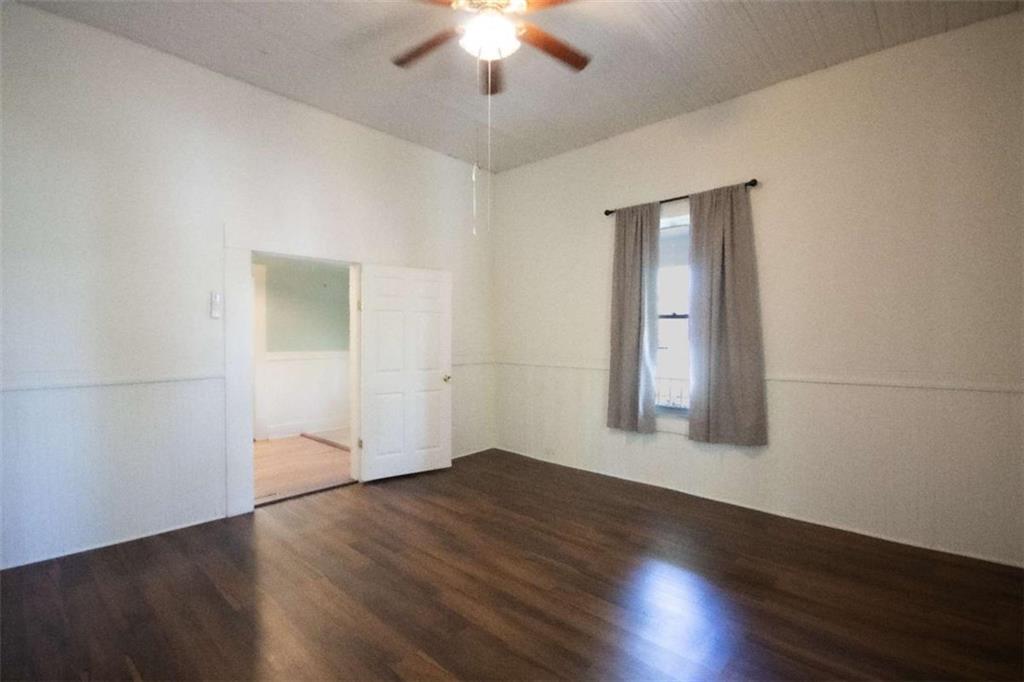 285 East Main Street Forsyth, GA 31029 - Photo 20 of 27 a view of an empty room with wooden floor and a window