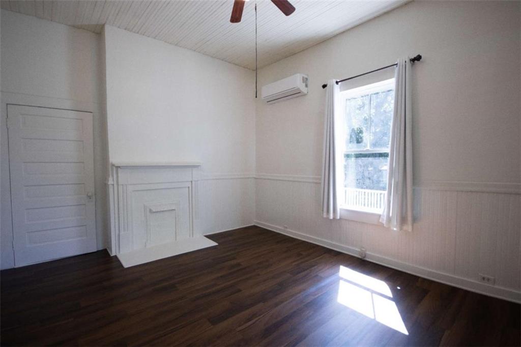 285 East Main Street Forsyth, GA 31029 - Photo 23 of 27 a view of an empty room with wooden floor and a window