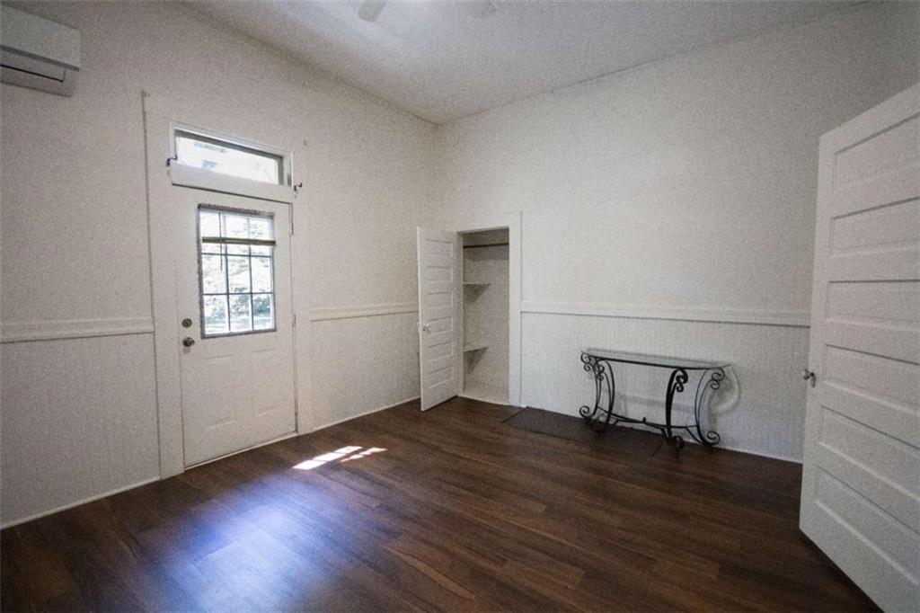 285 East Main Street Forsyth, GA 31029 - Photo 25 of 27 an empty room with wooden floor and windows