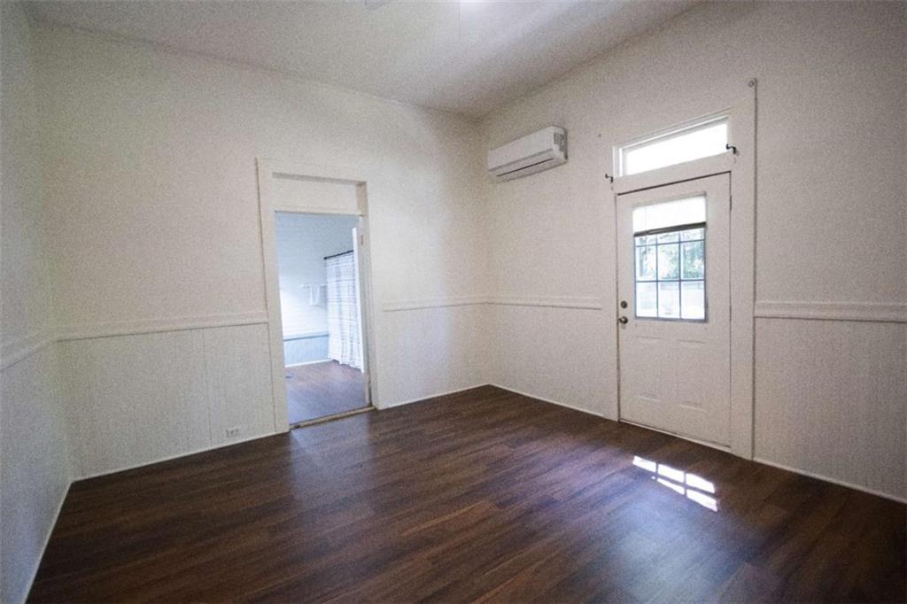 285 East Main Street Forsyth, GA 31029 - Photo 26 of 27 an empty room with wooden floor cabinet and windows