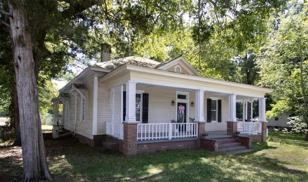 285 East Main Street Forsyth, GA 31029 - Photo 3 of 27 a view of a house with a yard and furniture